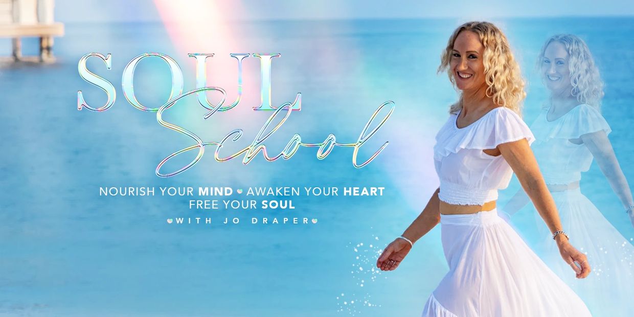 Smiling woman in white dress by the ocean with text 'Soul School'.