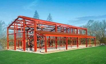 I beam metal barn in field