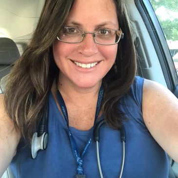 Jam Carder RN wearing nursing badge and stethoscope