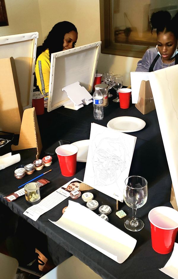 Vanity Logan and Reneece L Bailey paint at a Sip & Paint hosted by Greatest Matriarchs Society.