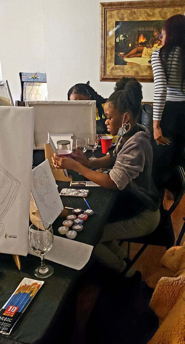 Reneece LeeQuioné Bailey paints at Greatest Mas Meet &Greet.