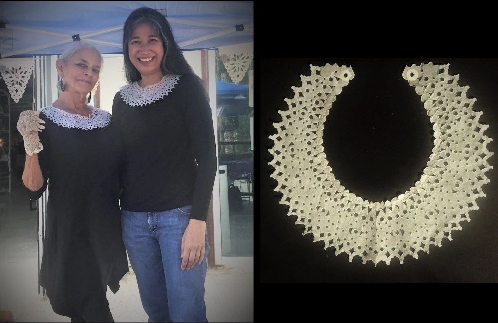 "My cut paper necklace in honor of the late Ruth B. Ginsburg." Photo of Heidi and I modeling it at M