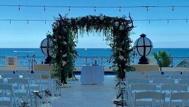 Oceanfront wedding ceremony on the 5th floor pool deck at the Atlantic hotel and spa