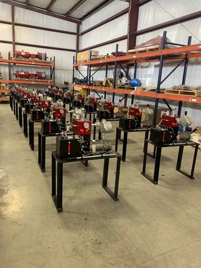 Rows of industrial machines in a warehouse.