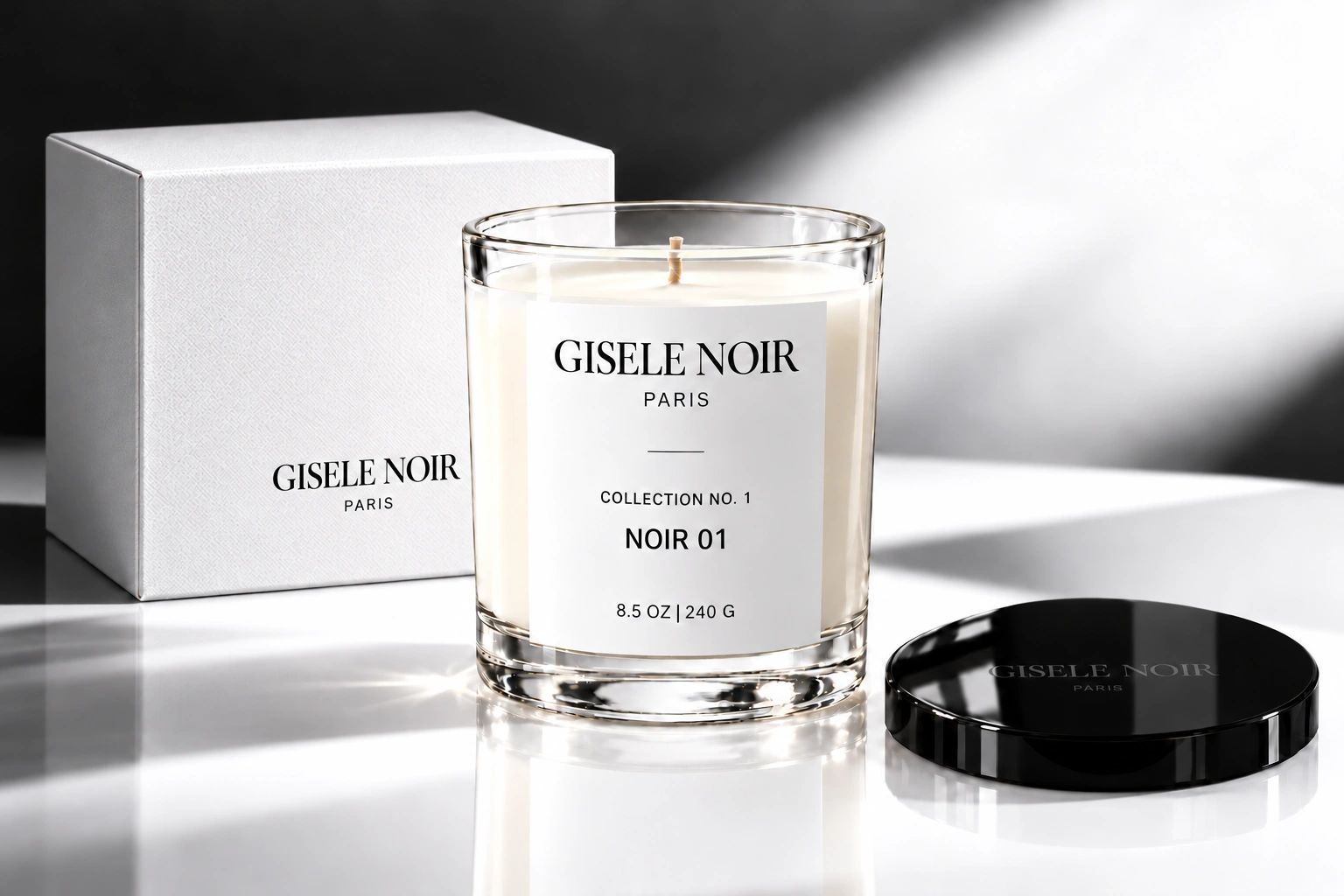 GISELE NOIR Noir 01 candle with its white gift box and glossy black signature lid