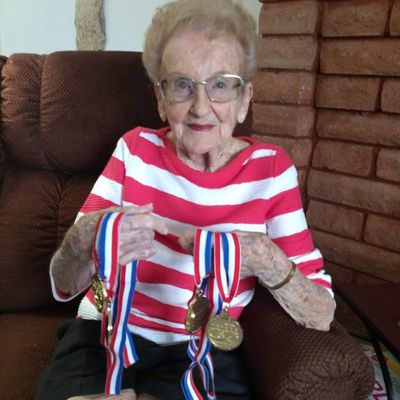 Evelyn (102) displays medals she won dancing with a "granny group" in a dancing contest in Las Vegas
