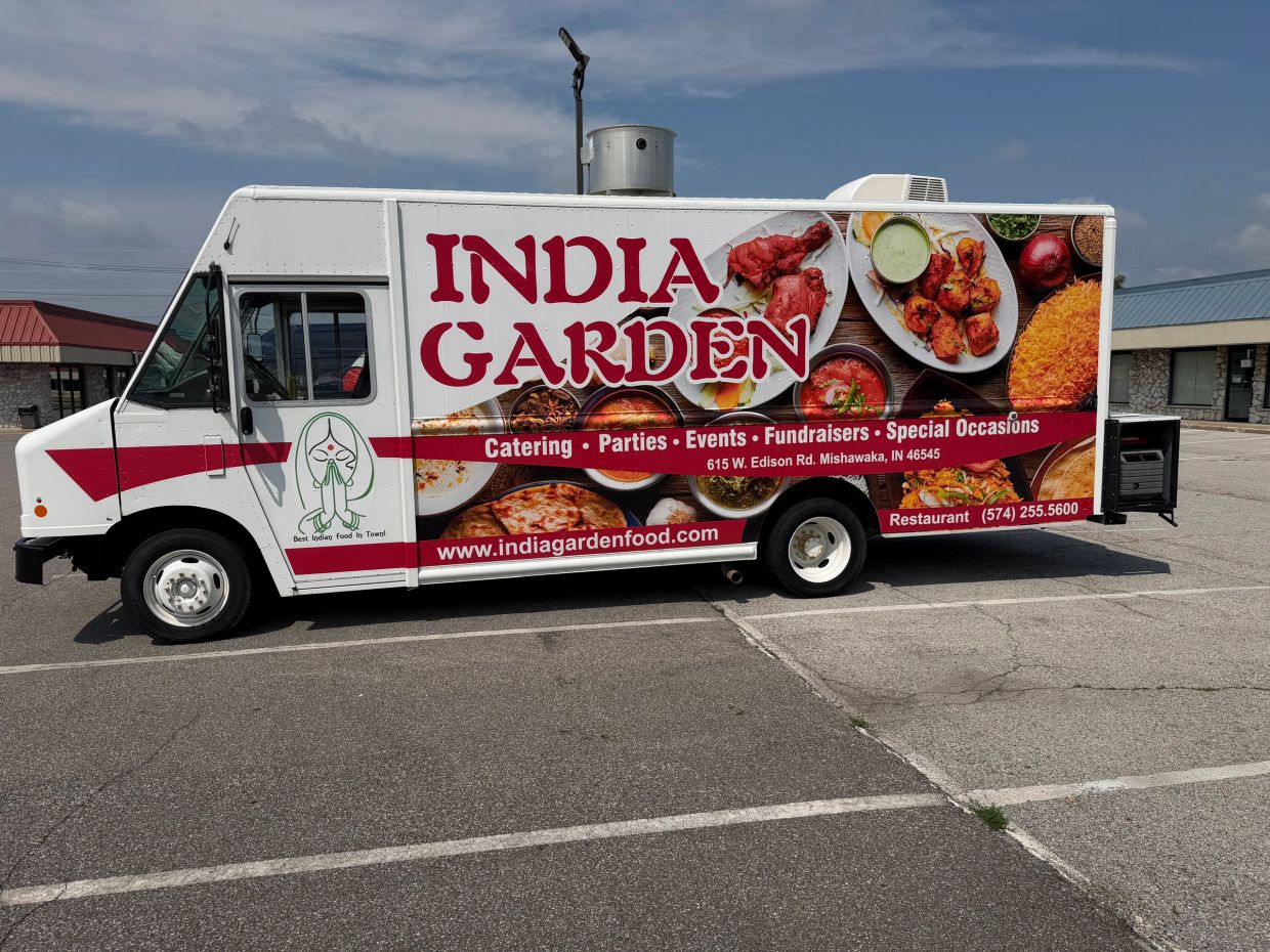 India Garden food truck with colorful Indian cuisine images.
