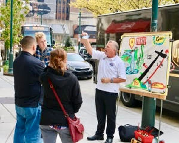 dr tony rizzo preaching at a street safety zone