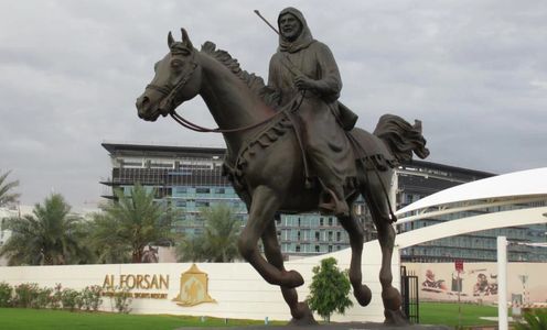 Custom bronze statue of an Arabian Horse and rider custom sculptured for Al Forsan Sports Resort.