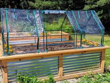 Raised garden bed with greenhouse cover