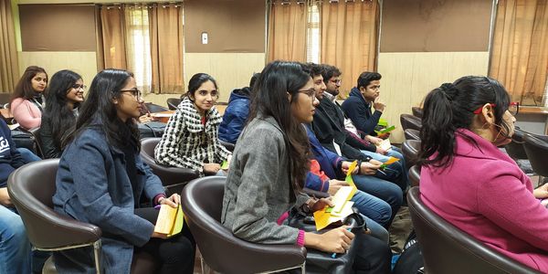 Students attentively participating in an indoor classroom session.