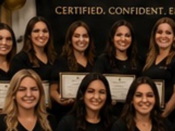 Group of smiling women holding certificates.
