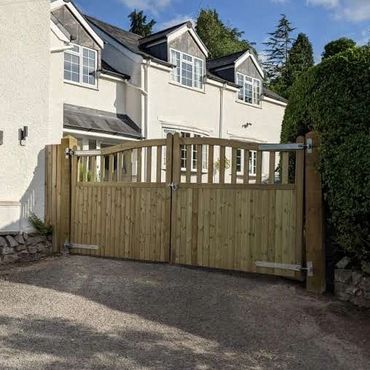 Large curved driveway gates.