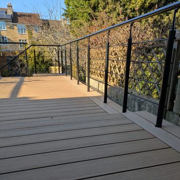 Large deck installation with integrated metal ballustrade.