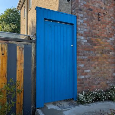 Blue garden gate for side access.
