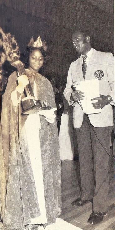 Home Coming Queen Ms.Darlene (Thomas) Fort is accepting the crowning of her title from Farley Seldom