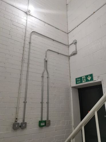 Door Entry system in metal conduit - Hannah Barry Art Studio.