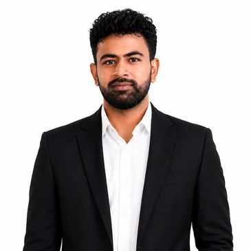 Man in black suit with white shirt against white background.