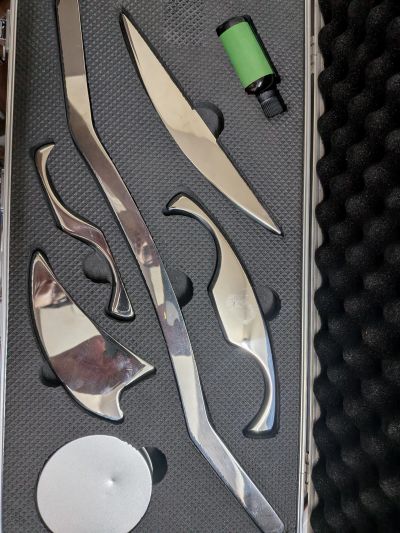 Set of shiny metal tools in a protective case.