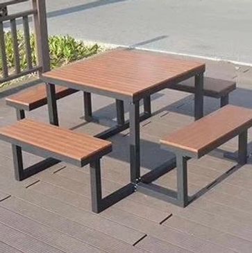 Outdoor wooden picnic table with four benches on a deck. bancas de acero inoxidable
papeleras
paradas