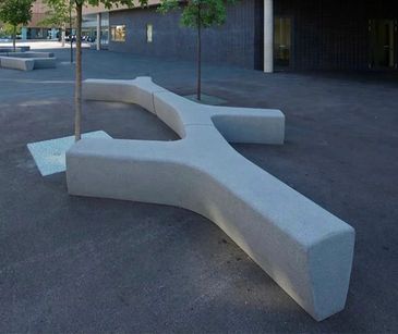 Y-shaped concrete bench with trees in an urban outdoor setting. bancas de acero inoxidable
papeleras
paradas