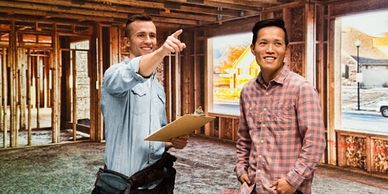 Happy contractor showing home to buyer.