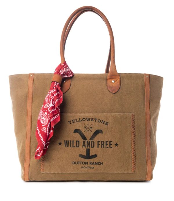 Brown canvas tote bag with leather handles and red bandana.