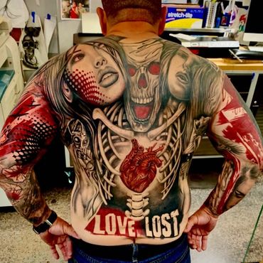 Trash Polka Tattoos by Oriana Tattoo. Back piece tattoo by tattoo artist: Luis Carmona