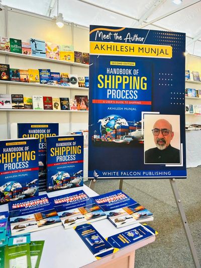 Book display for 'Handbook of Shipping Process' by Akhilesh Munjal at a book fair.