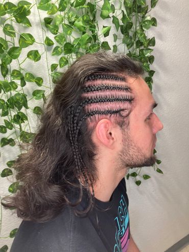 This gentleman booked 1-4 cornrows to compliment his unique style in our luxury salon environment