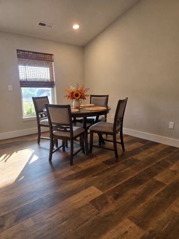 Dining area in the Patt’s Place Modern Camping Suite with seating for four.