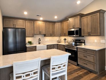 Full modern kitchen in the Patt’s Place Modern Camping Suite with full-size appliances, island seati