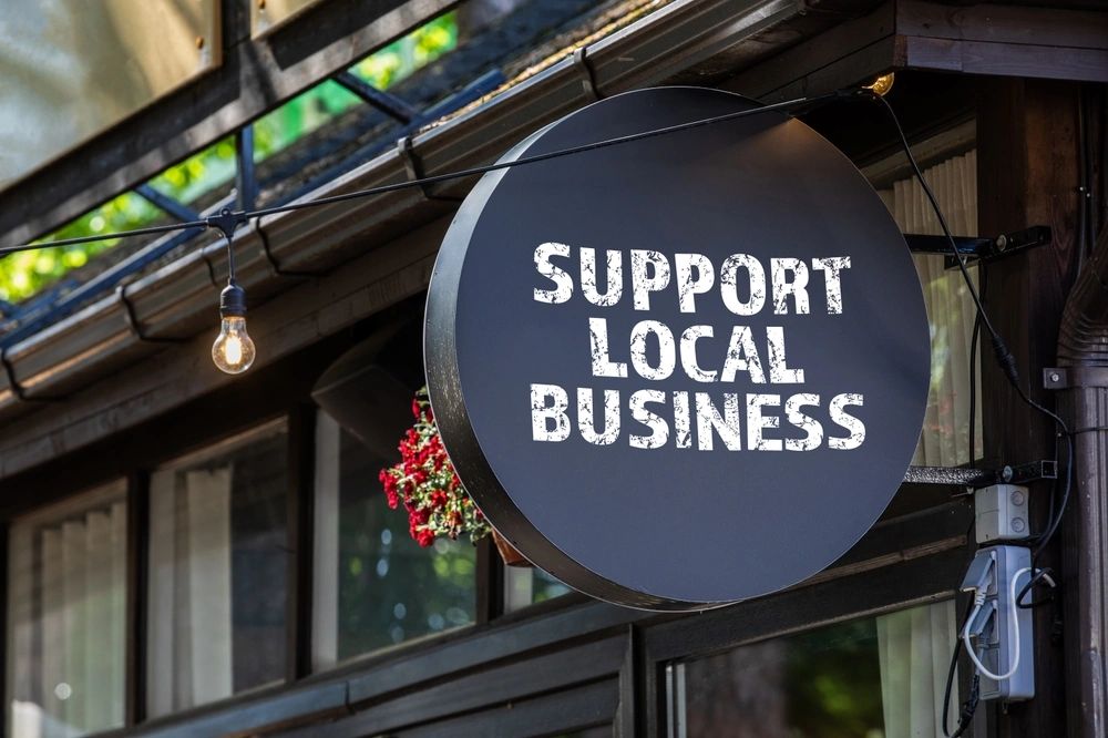 Sign reading 'Support Local Business'  symbolizing trust with local business