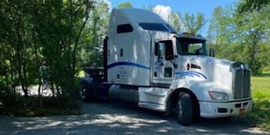 Sandell Transport truck delivering a rural area