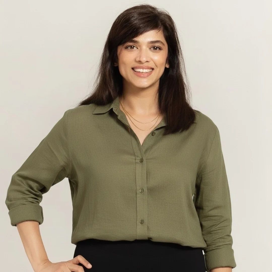 A woman looking at the camera and smiling