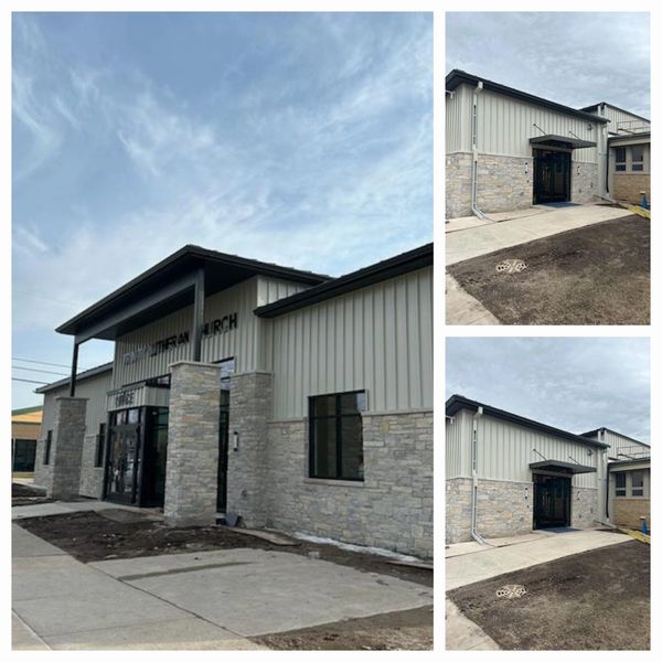 Almond board and batten metal siding panels and open downspouts installed – Neenah church project