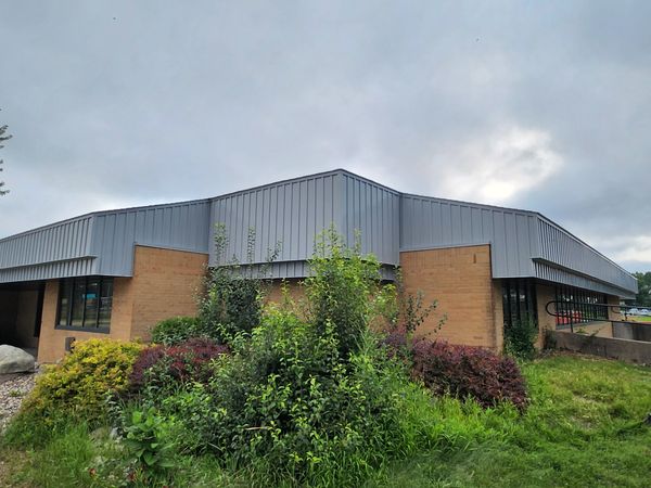 Installation of Board and Batten Siding at school building in Oshkosh, WI.