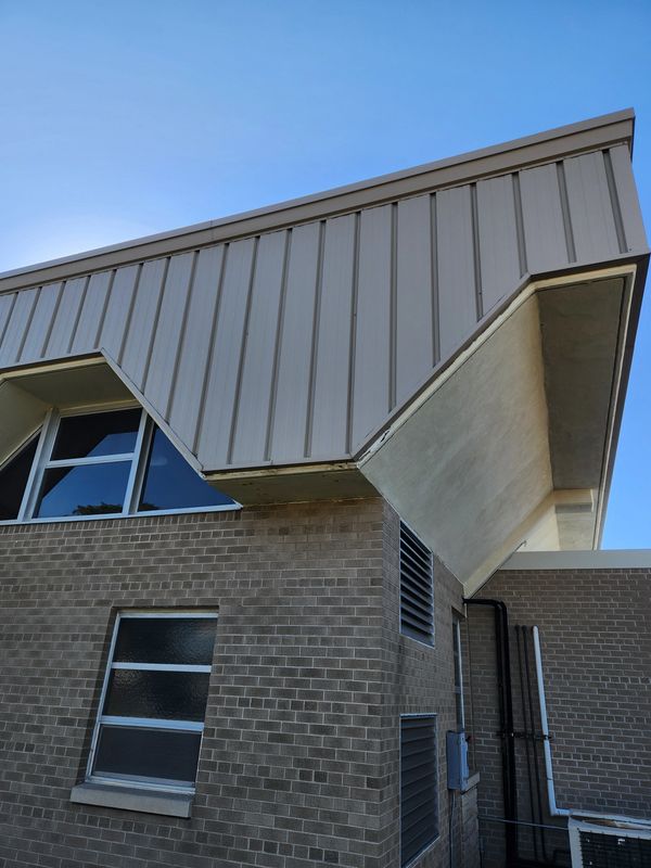 Board and Batten Siding at Lourdes Academy - Oshkosh, WI. Custom metal siding panels fabricated.