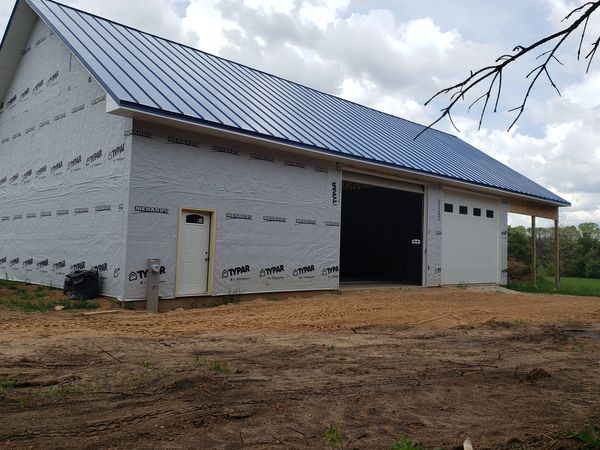 Pole shed roof and siding panels installed with snow guards in Regal Blue – Wautoma, Wisconsin