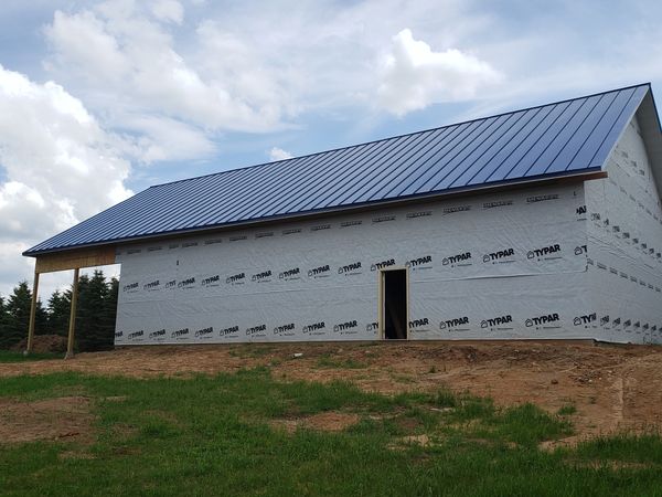 Pole shed metal roof and siding installed with snow guards in Regal Blue – Wautoma, Wisconsin