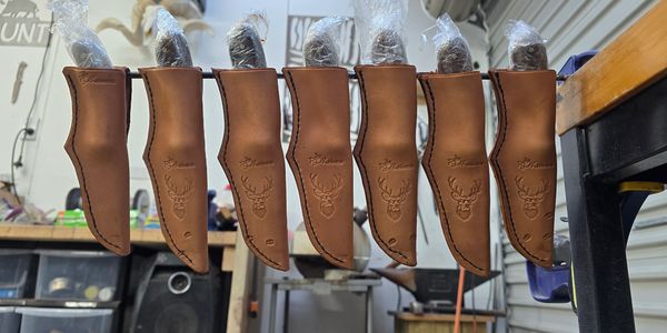 Knives with custom molded sheaths