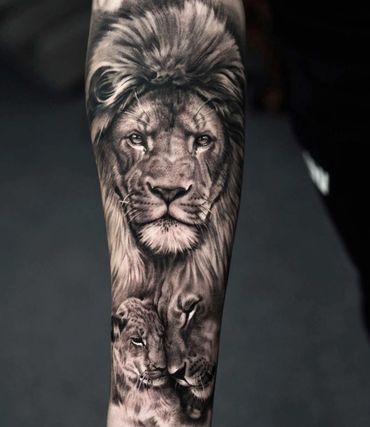 Black and grey realism lion portrait tattoo by Amber Tattoos Ajax ON
