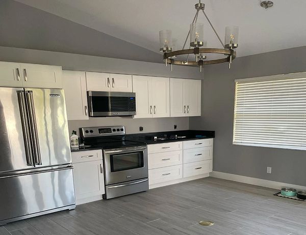 Kitchen walls and cabinets painted by Myers Cape Coral Painting.