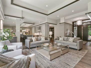 Modern spacious living room with neutral tones.