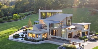 Modern luxury house with large windows and landscaped greenery.