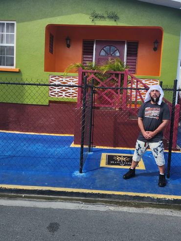 Infinite outside of Rihanna's childhood home. In Bridgetown, Barbados