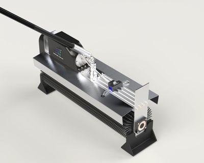 A sleek, modern cleaning or grooming tool with a metallic body and brush bristles on the bottom.