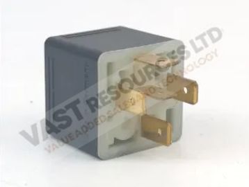 A small black electrical relay with three brass prongs.