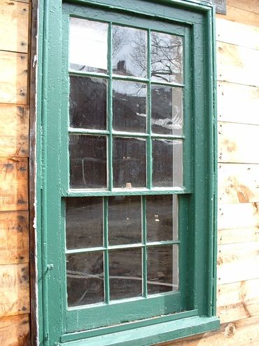Late 1700's nine-over-six window BEFORE restoration.