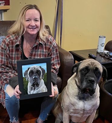 Margot's daughter holding Phoebe's painting w/Phoebe